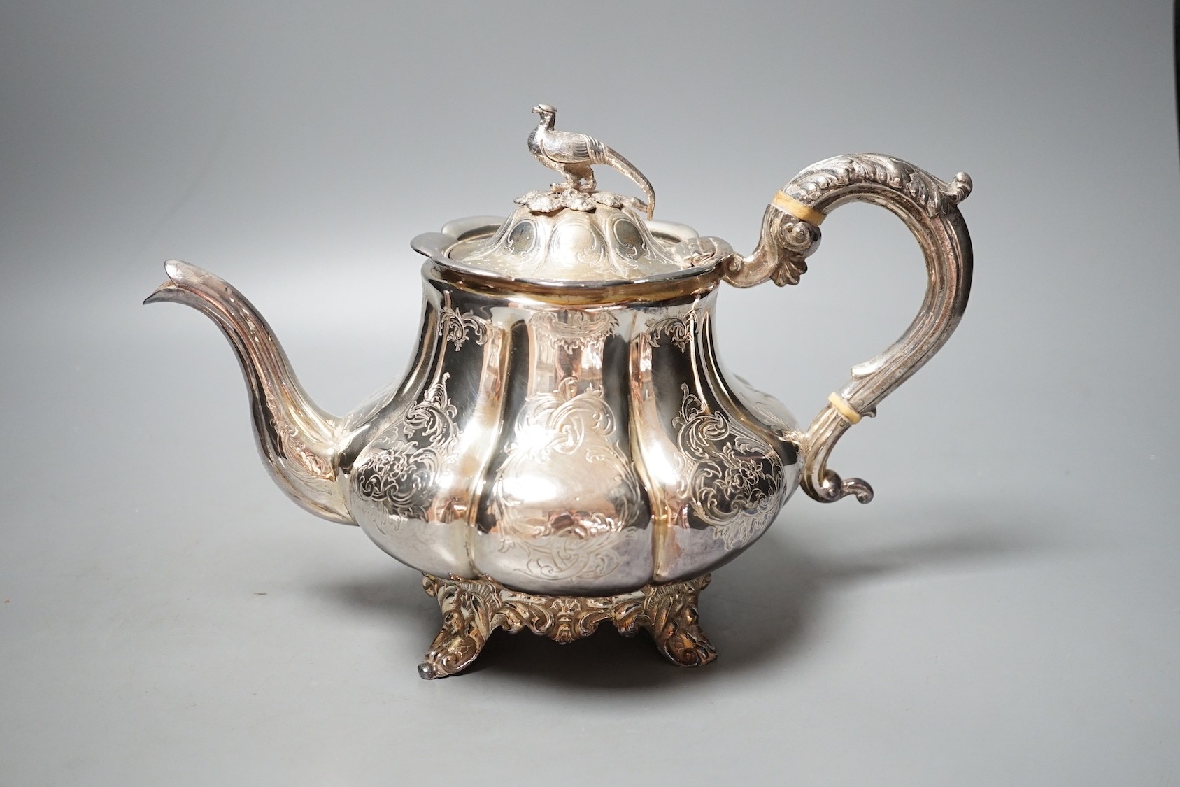 An early Victorian silver teapot, with bird finial, William Hewitt, London, 1844, gross 26.5oz.